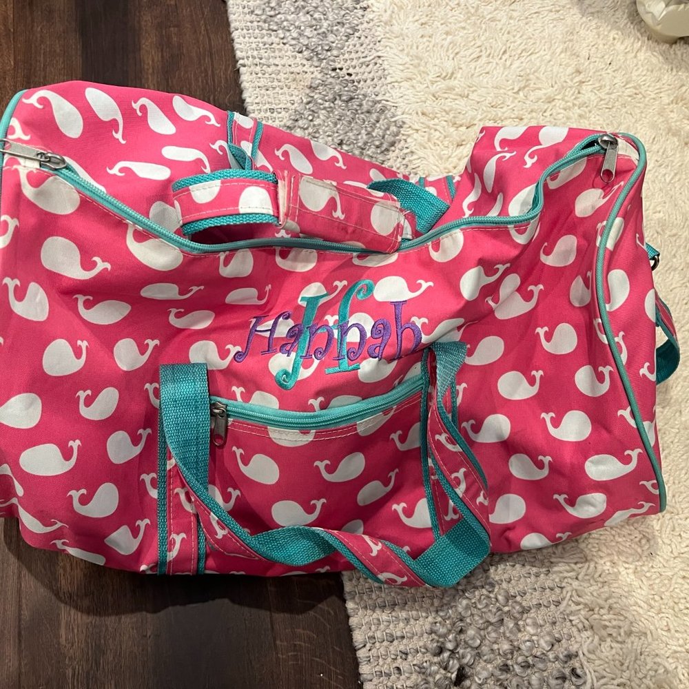 Pink and green duffel bag